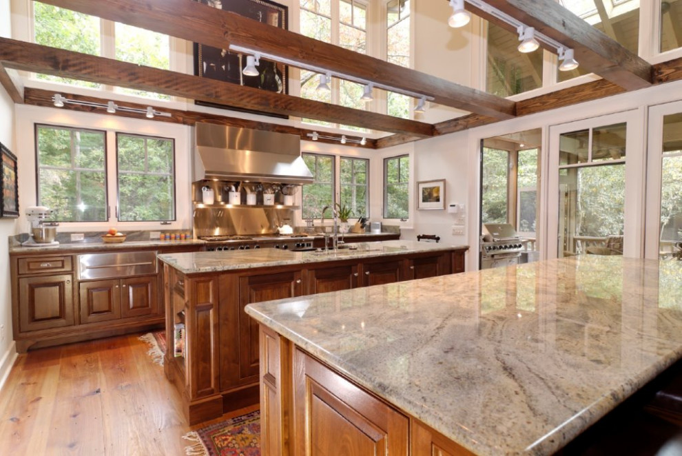 Photo of a modern kitchen with marble benchtops.