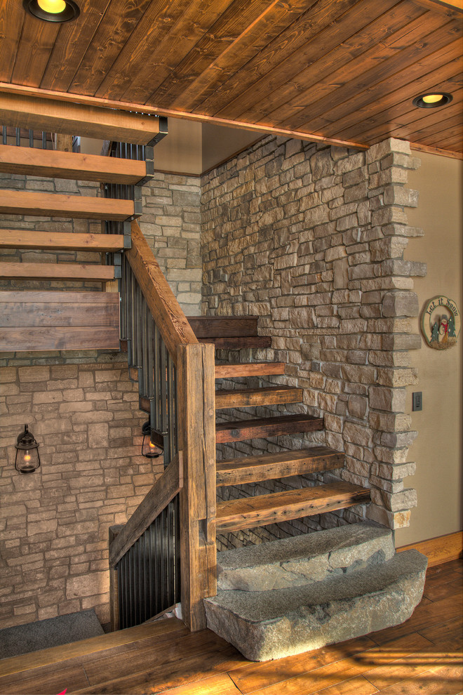 Photo of a mid-sized country wood u-shaped staircase in Minneapolis with wood risers and mixed railing.
