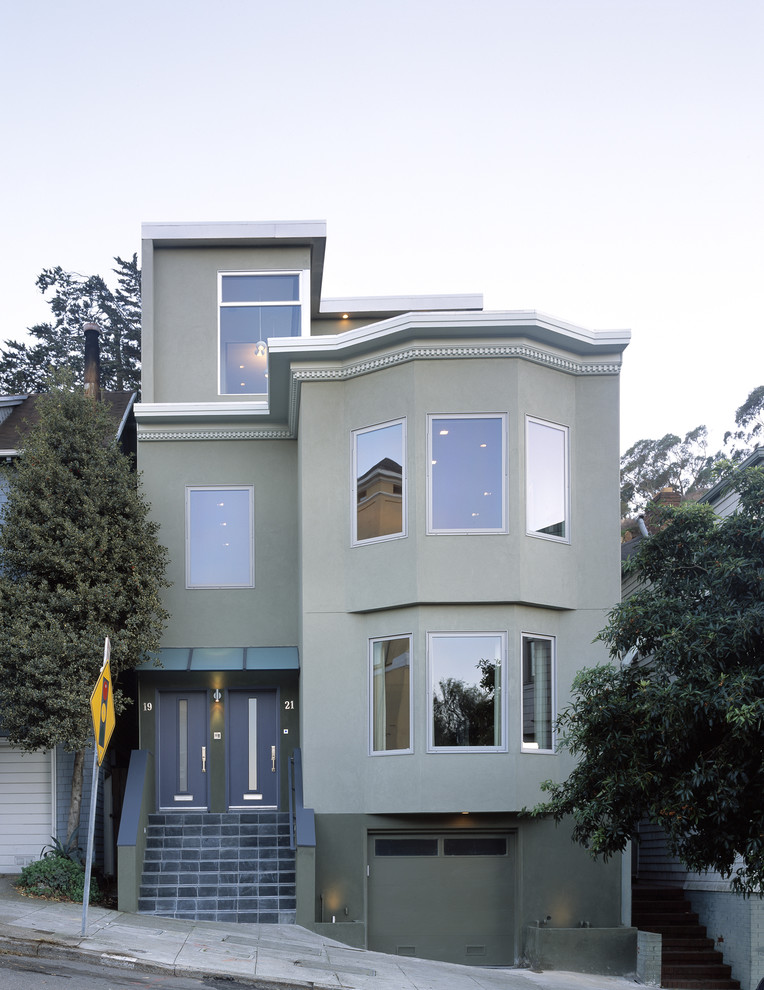 Photo of a transitional three-storey duplex exterior in San Francisco.