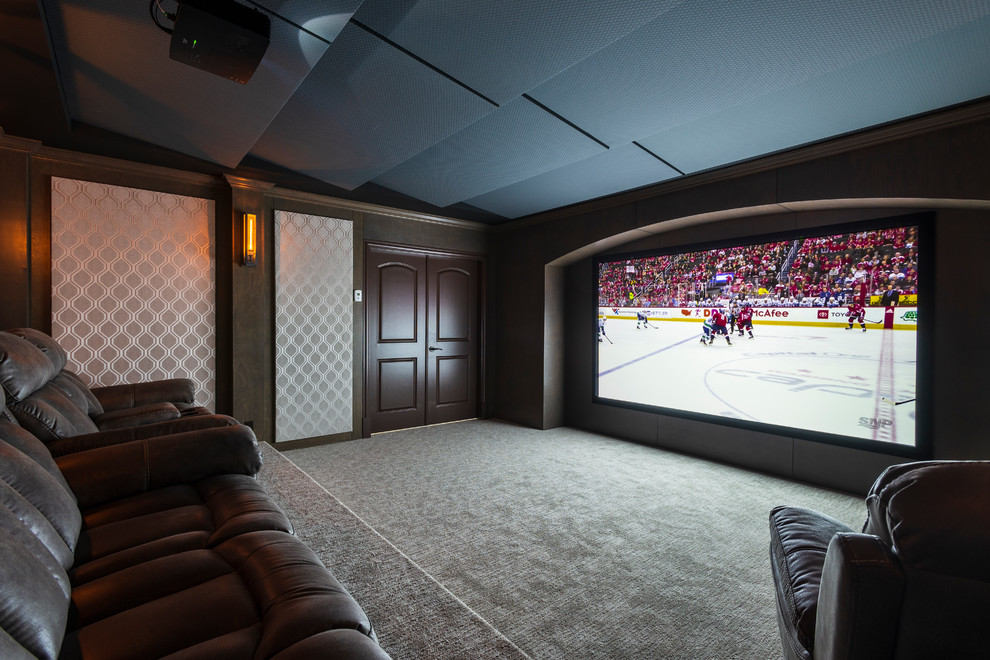 Design ideas for a large traditional enclosed home theatre in Vancouver with multi-coloured walls, carpet, a projector screen and grey floor.
