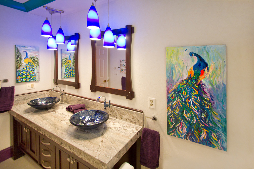 Inspiration for a mid-sized transitional master slate floor bathroom remodel with a vessel sink, recessed-panel cabinets, dark wood cabinets, granite countertops, a one-piece toilet and gray walls