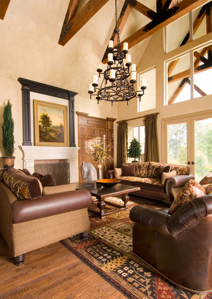 Design ideas for a large traditional open concept living room in Other with beige walls, a standard fireplace, medium hardwood floors, a stone fireplace surround and brown floor.