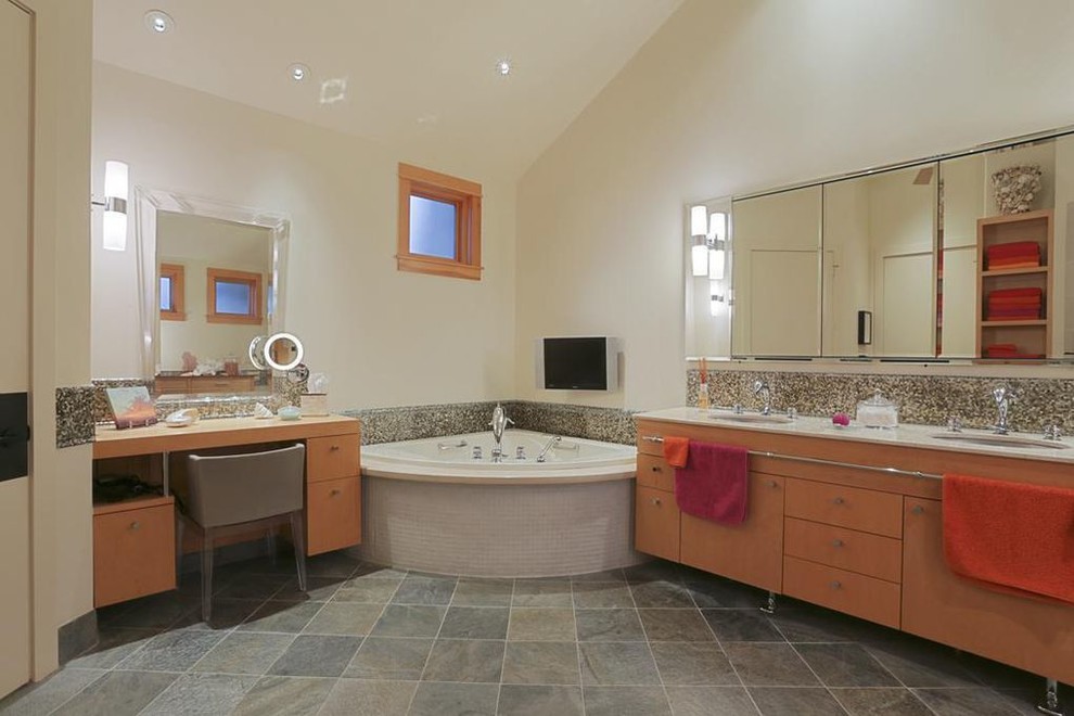 Inspiration for a mid-sized country master bathroom in Houston with flat-panel cabinets, light wood cabinets, a corner tub, an alcove shower, multi-coloured tile, glass tile, beige walls, slate floors, an undermount sink, quartzite benchtops, grey floor, an open shower and white benchtops.