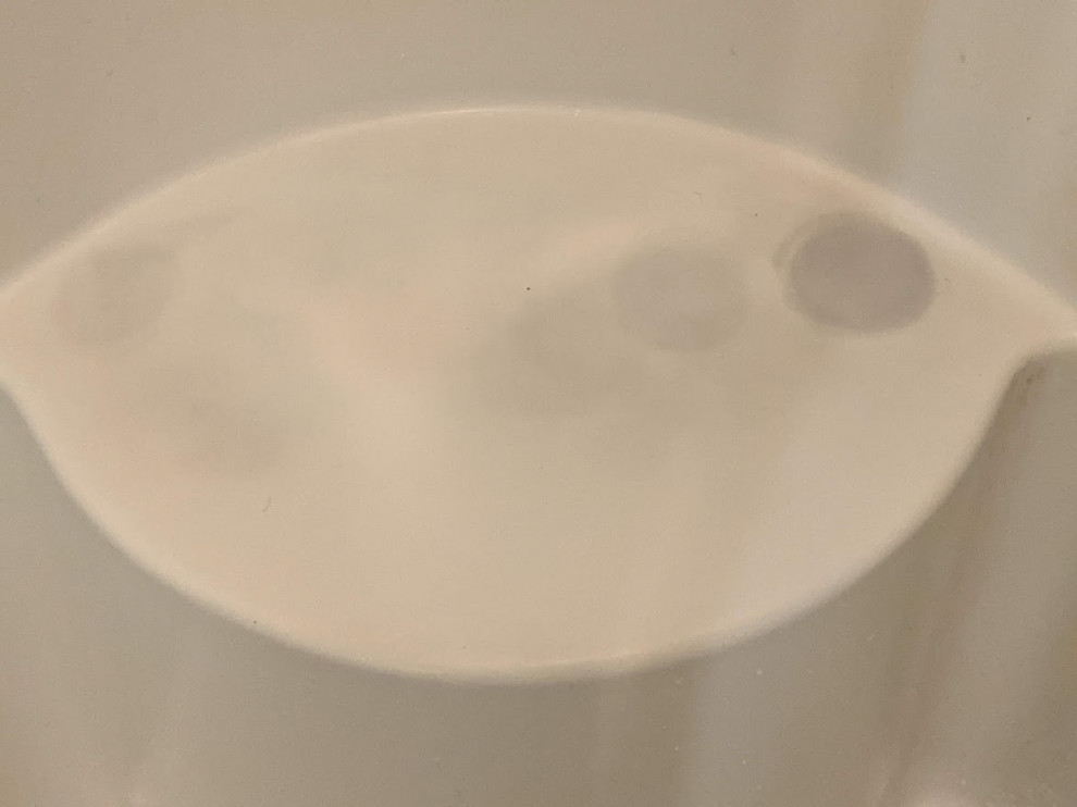 Remove stains in a fiberglass shower