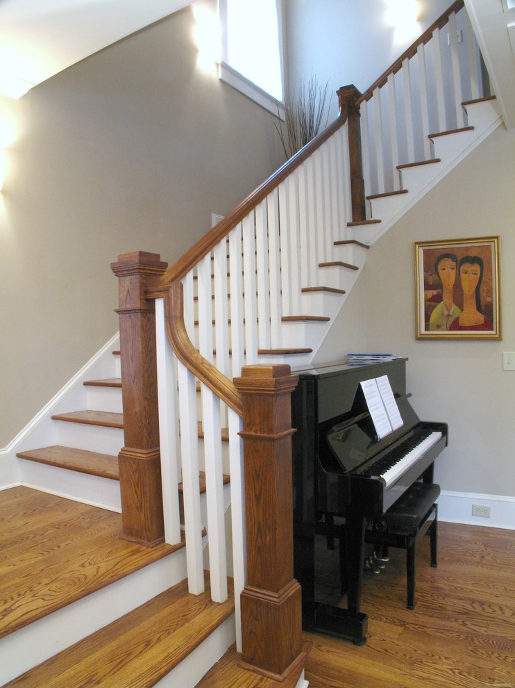 Design ideas for a mid-sized traditional wood l-shaped staircase in Atlanta with painted wood risers.