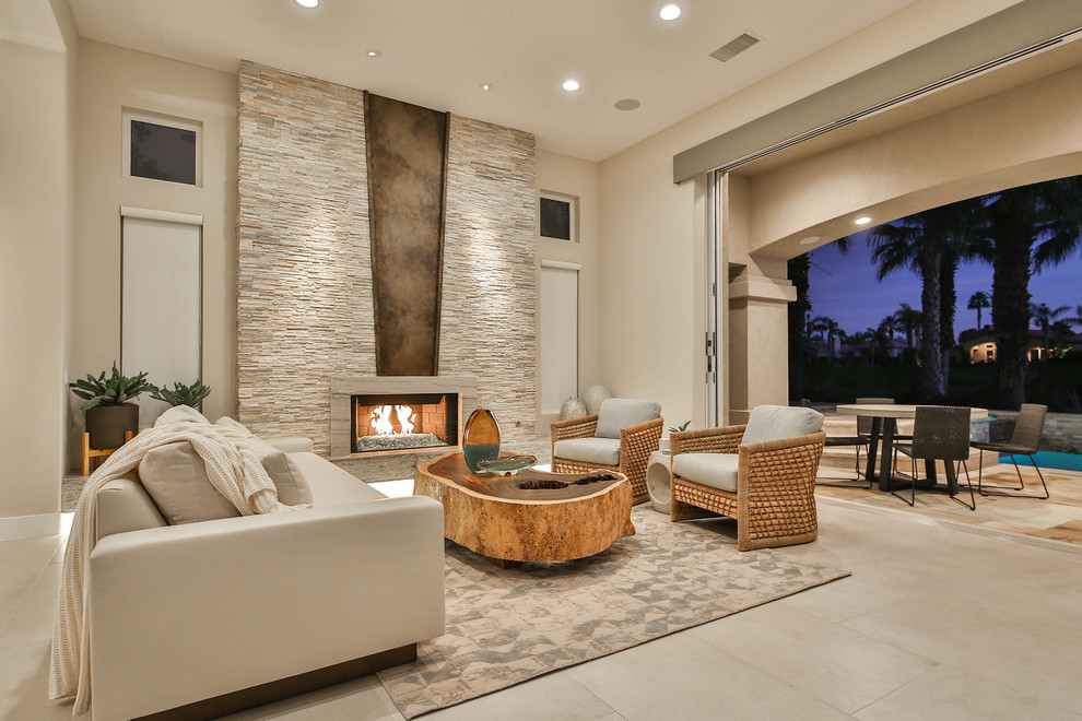 Inspiration for a mid-sized contemporary formal open concept living room in San Diego with beige walls, a stone fireplace surround, no tv, beige floor, travertine floors and a ribbon fireplace.