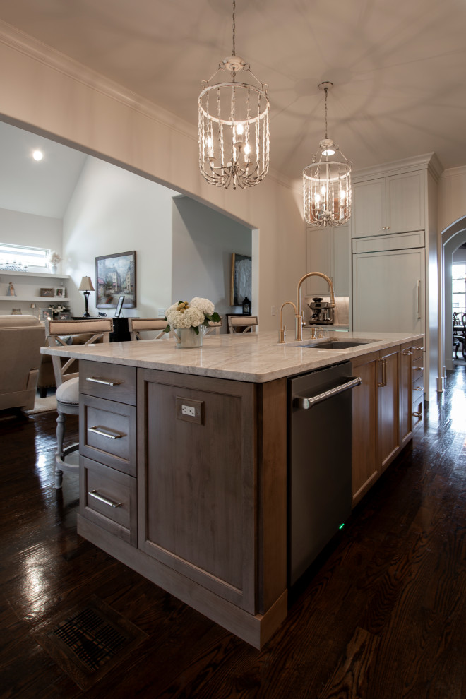 Large transitional l-shaped dark wood floor and brown floor open concept kitchen photo in Nashville with an undermount sink, beaded inset cabinets, white cabinets, quartzite countertops, beige backsplash, stone slab backsplash, stainless steel appliances, an island and beige countertops