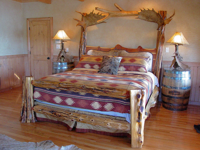 Rustic Log Bed With Brindle Cowhide Headboard And Moose Antler