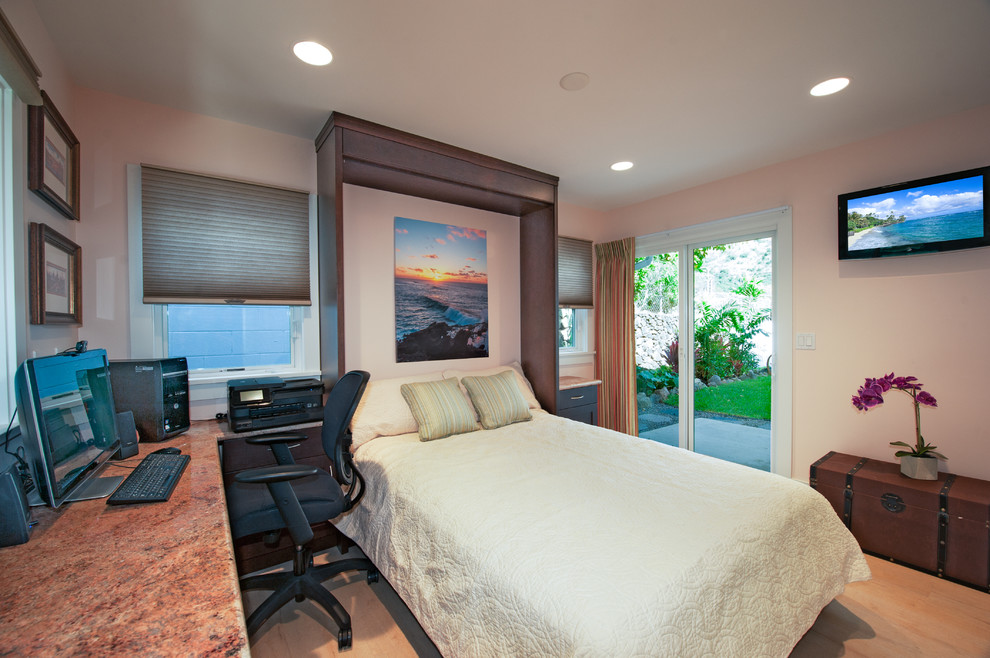 This is an example of a traditional bedroom in Hawaii with pink walls, vinyl floors and no fireplace.