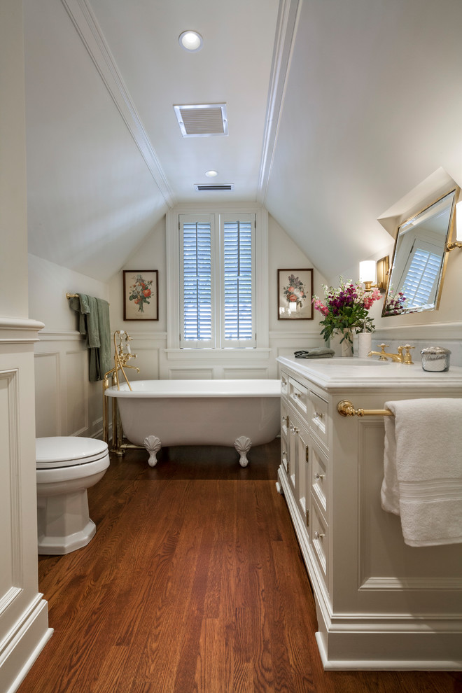 Inspiration for a traditional 3/4 bathroom in Other with a freestanding tub, recessed-panel cabinets, white cabinets, a shower/bathtub combo, white walls, medium hardwood floors, an undermount sink, brown floor and an open shower.