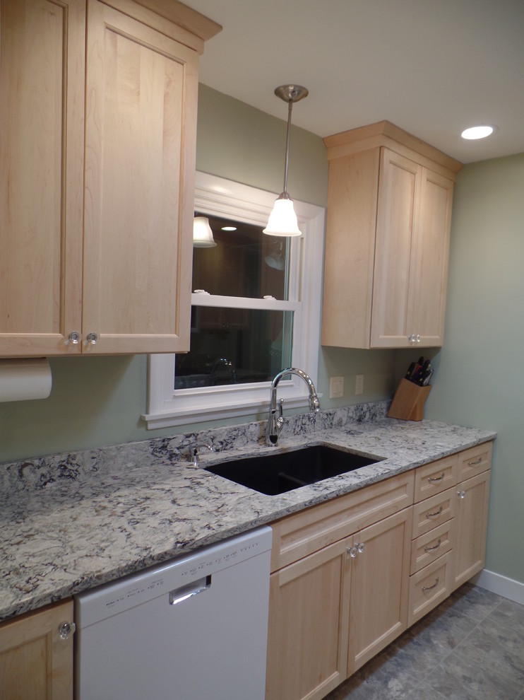 Inspiration for a mid-sized transitional galley vinyl floor eat-in kitchen remodel in Cedar Rapids with an undermount sink, shaker cabinets, light wood cabinets, quartz countertops, white appliances and no island