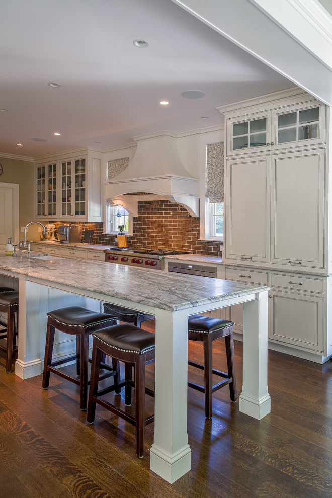 Eat-in kitchen - mid-sized transitional galley dark wood floor eat-in kitchen idea in Bridgeport with recessed-panel cabinets, gray cabinets, granite countertops, gray backsplash, subway tile backsplash, stainless steel appliances and two islands