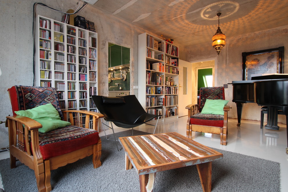 Inspiration for a large eclectic enclosed living room in Berlin with grey walls.