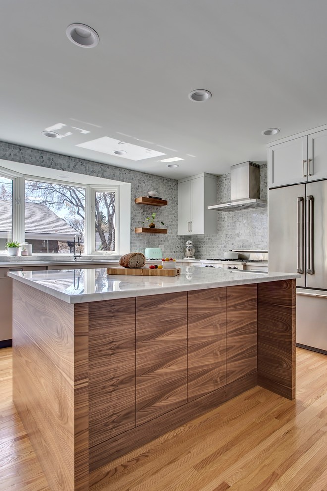Example of a transitional kitchen design in Calgary