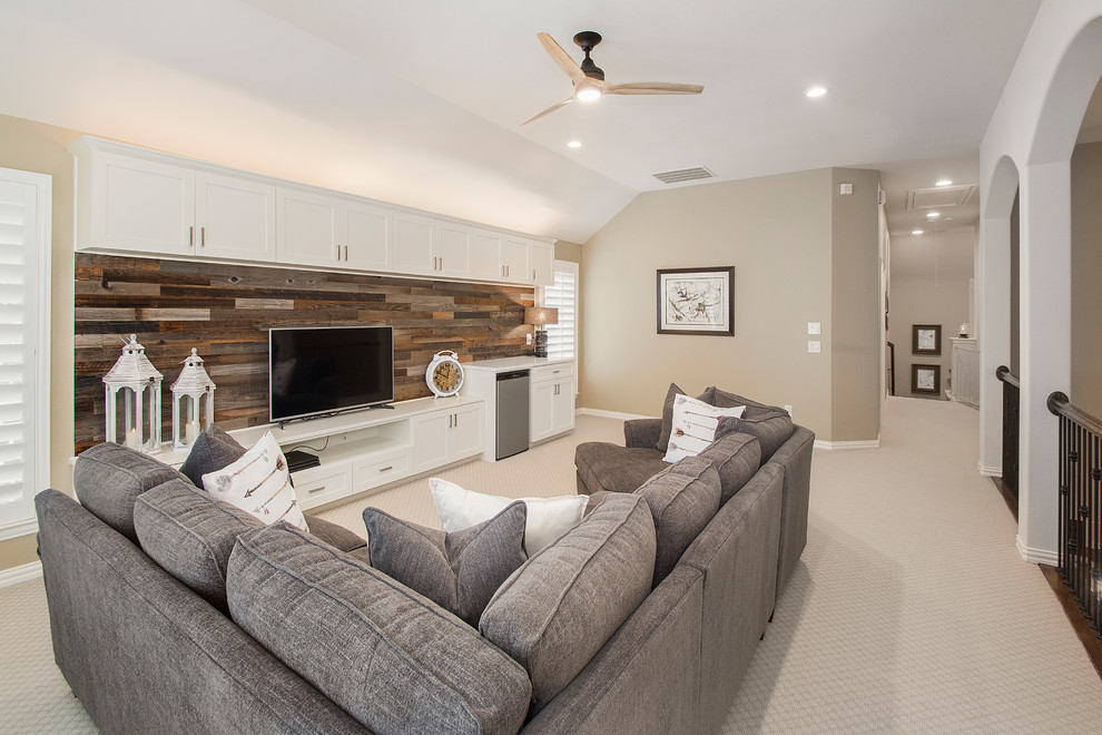 This is an example of a mid-sized transitional open concept family room in Dallas with a game room, beige walls, carpet, no fireplace, a freestanding tv and beige floor.