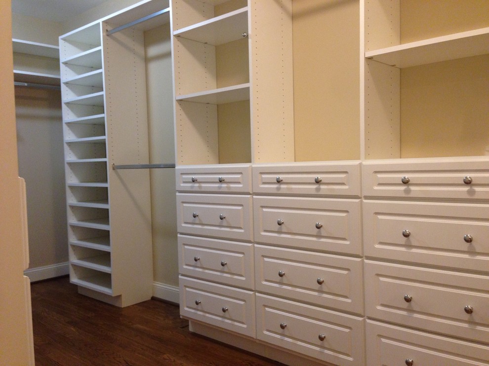 Inspiration for a contemporary gender-neutral walk-in wardrobe in Birmingham with white cabinets.