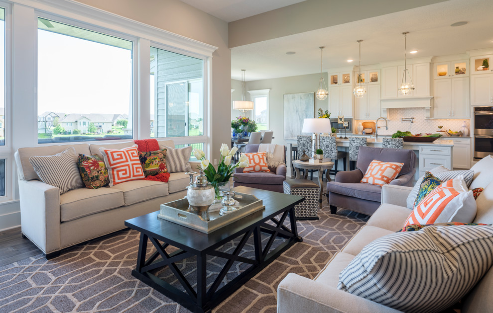 Example of a transitional open concept dark wood floor and brown floor living room design with gray walls