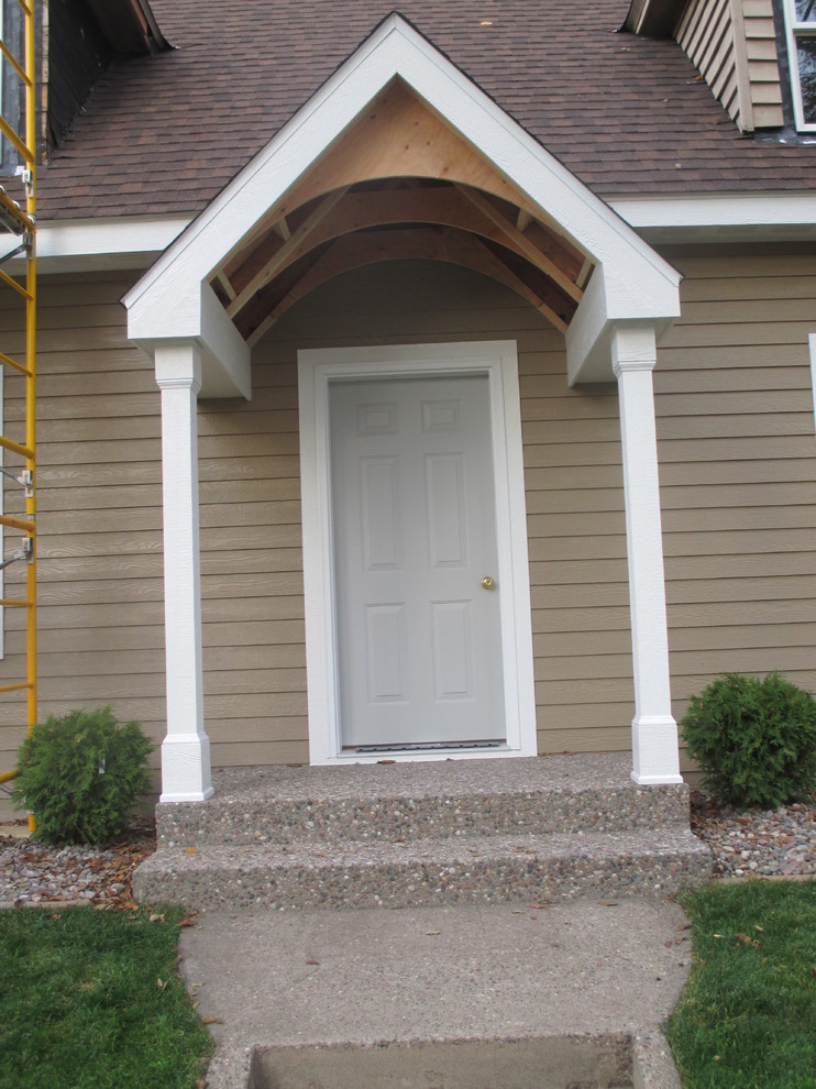 Portico interior roof, front door, and details on renovated 1935 Cape