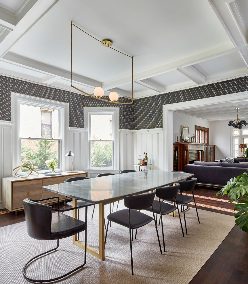 This is an example of a medium sized eclectic enclosed dining room in New York with dark hardwood flooring, a coffered ceiling, wainscoting, wallpapered walls and multi-coloured walls.