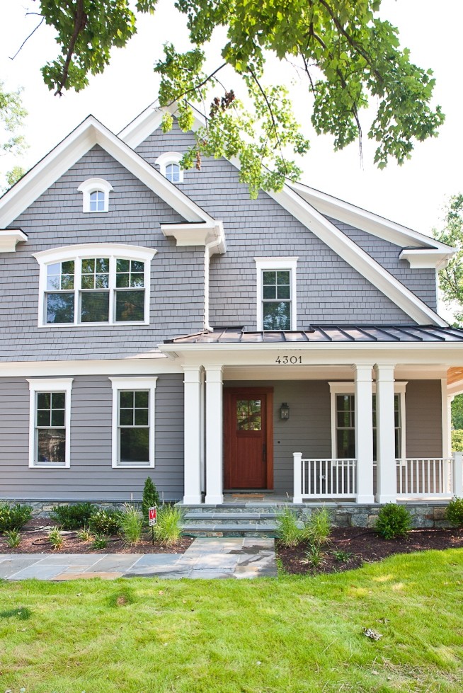 Inspiration for a traditional two-storey grey exterior in DC Metro with wood siding.