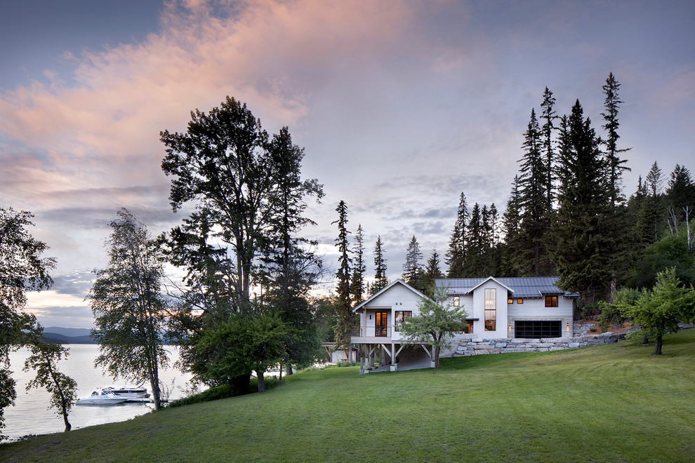 Cottage white two-story exterior home photo in Other with a metal roof