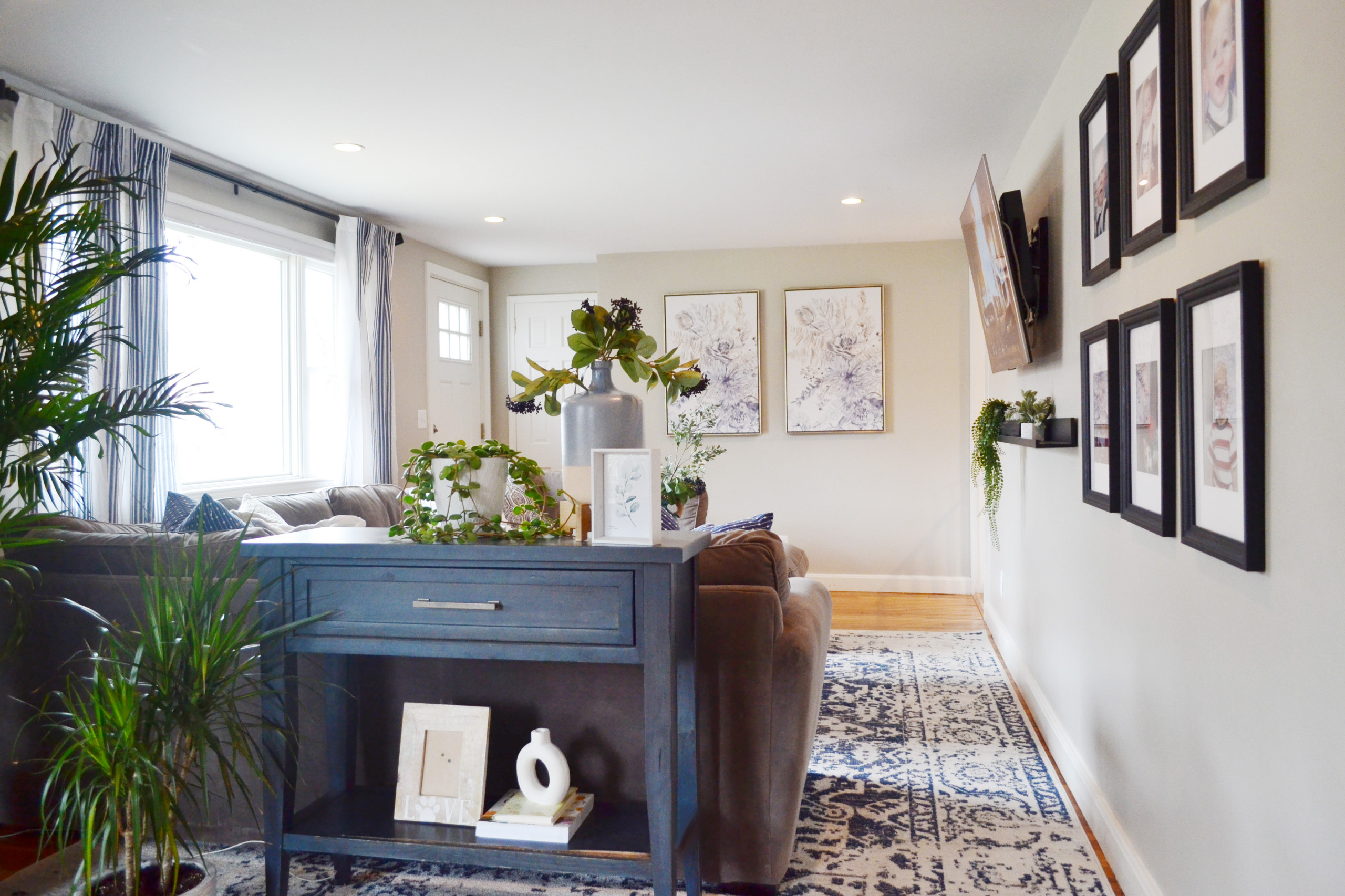 The "Nautical Green Living" project was a residential project that included an open living room space, dining room, and entryway. The client struggled with creating an inviting open room without it be