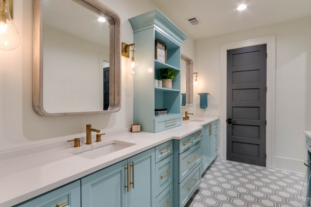 Inspiration for a mid-sized country kids bathroom in Atlanta with shaker cabinets, turquoise cabinets, a two-piece toilet, white tile, porcelain tile, white walls, porcelain floors, an undermount sink, engineered quartz benchtops, blue floor, a hinged shower door, white benchtops, a shower seat, a double vanity and a built-in vanity.