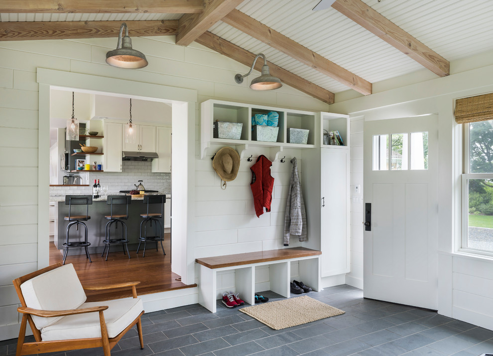 Transitional gray floor single front door photo in Providence with beige walls and a white front door