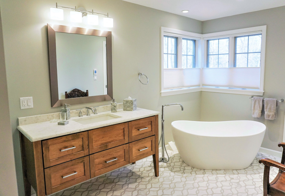 Example of a mid-sized transitional master marble floor, multicolored floor and single-sink toilet room design with flat-panel cabinets, brown cabinets, quartz countertops, a hinged shower door and a built-in vanity