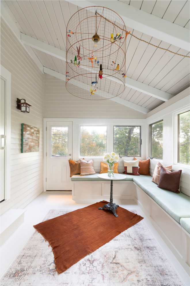 This is an example of a transitional sunroom in New York with white floor.