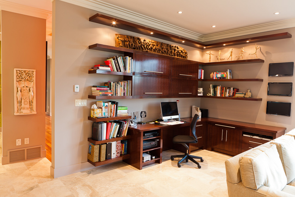 This is an example of a contemporary home office in Edmonton with a built-in desk.