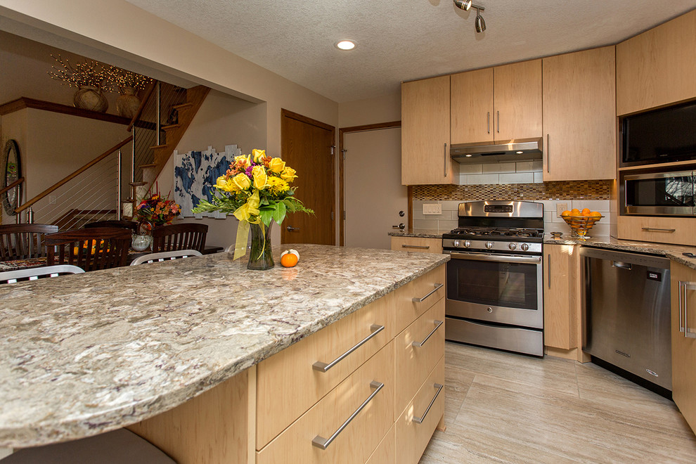 Inspiration for a mid-sized transitional l-shaped porcelain tile open concept kitchen remodel with an undermount sink, flat-panel cabinets, light wood cabinets, beige backsplash, stainless steel appliances, an island, quartz countertops and porcelain backsplash