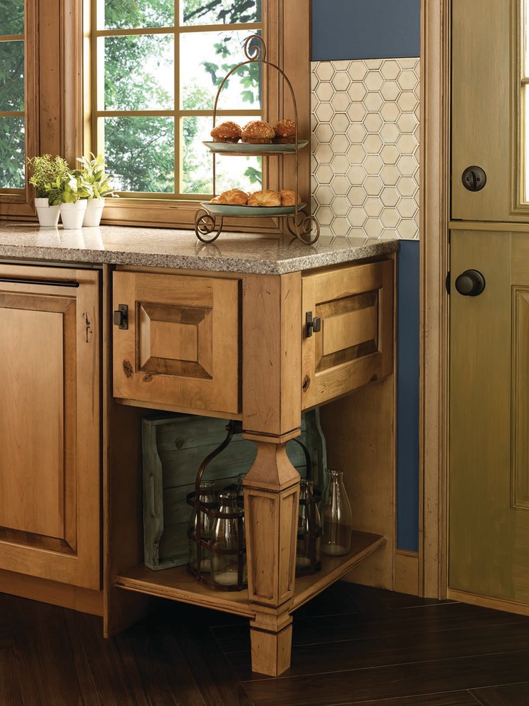 Mountain style l-shaped kitchen photo in Denver with raised-panel cabinets, light wood cabinets, granite countertops and an island