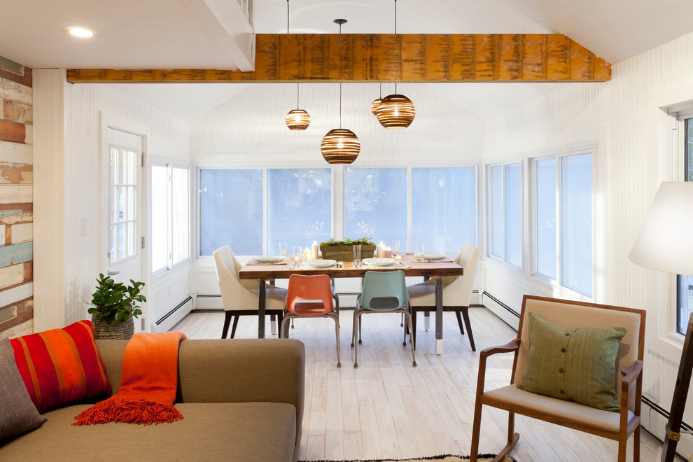 This is an example of a beach style open plan dining in New York.