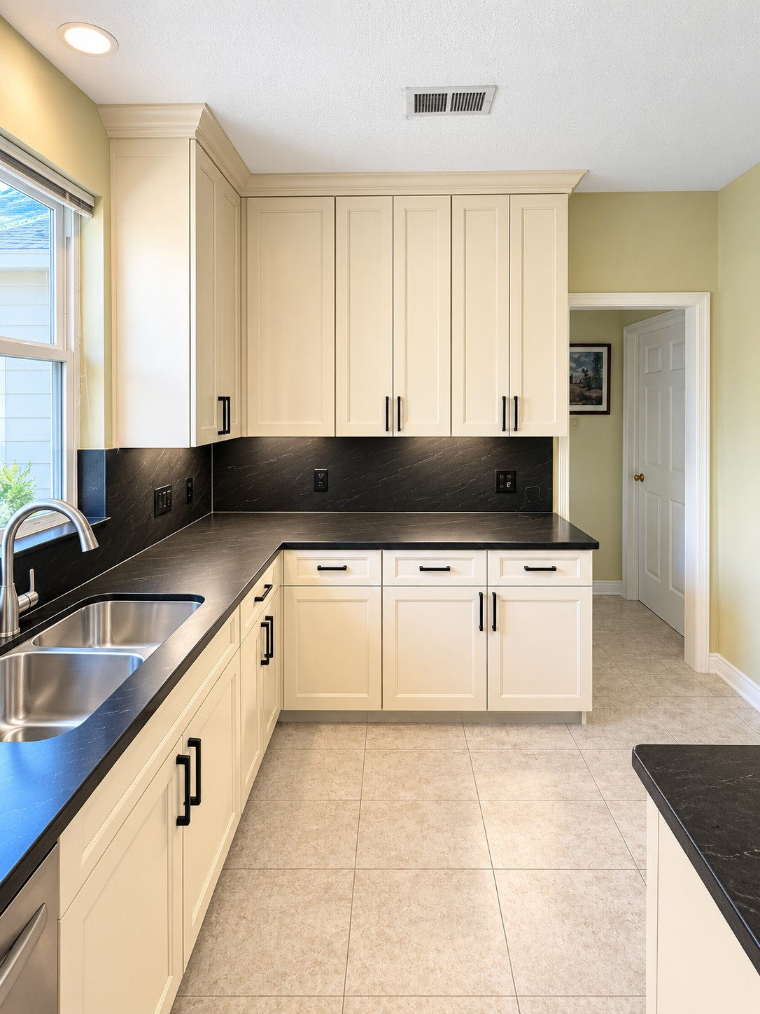 Custom Transitional Kitchen with Cream Shaker Cabinets & Black Countertops