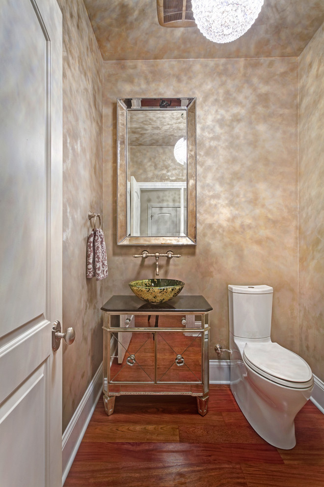 Transitional powder room in Chicago with a vessel sink.