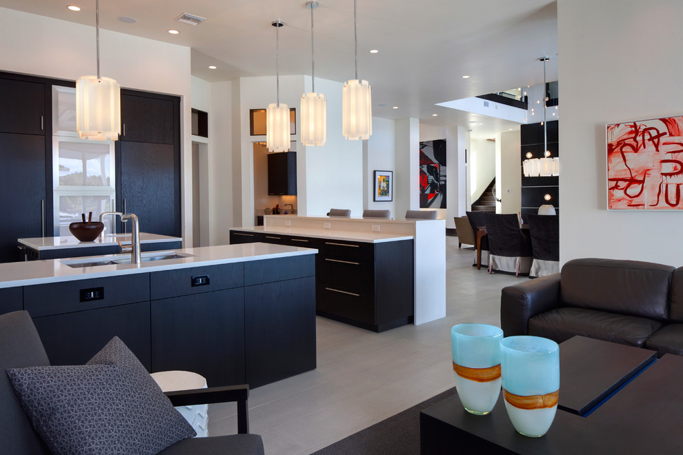 Design ideas for a modern open plan kitchen in Orlando with an undermount sink, flat-panel cabinets and black cabinets.