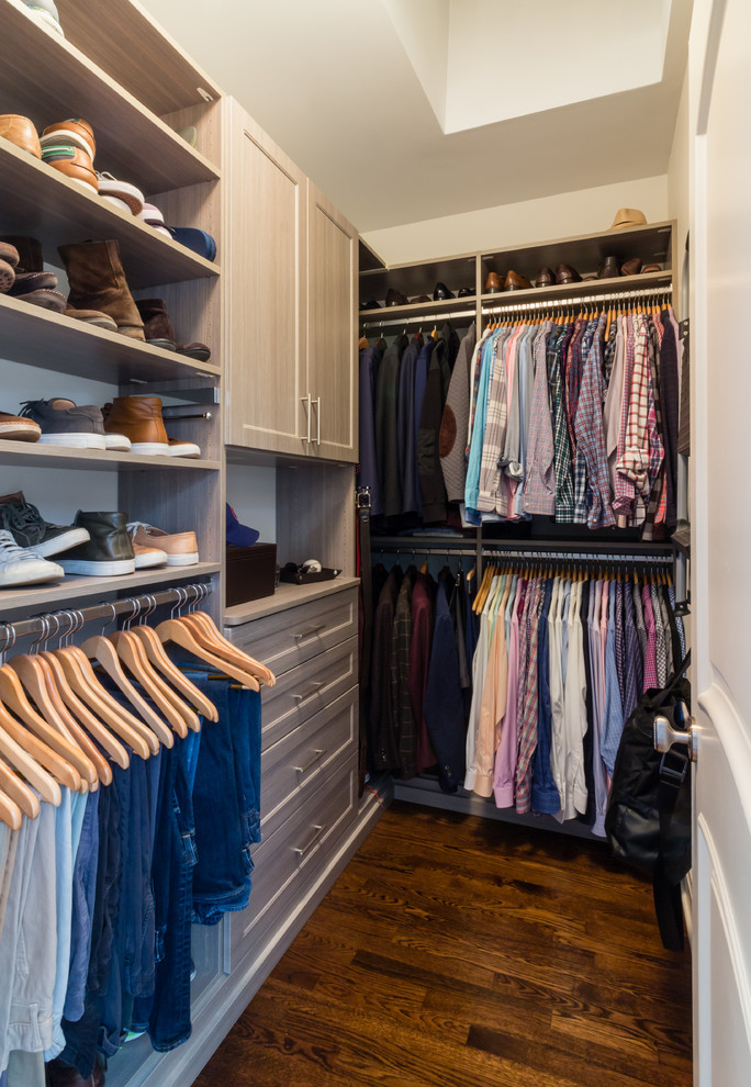 Design ideas for a transitional men's walk-in wardrobe in Boston with shaker cabinets, light wood cabinets, medium hardwood floors and brown floor.