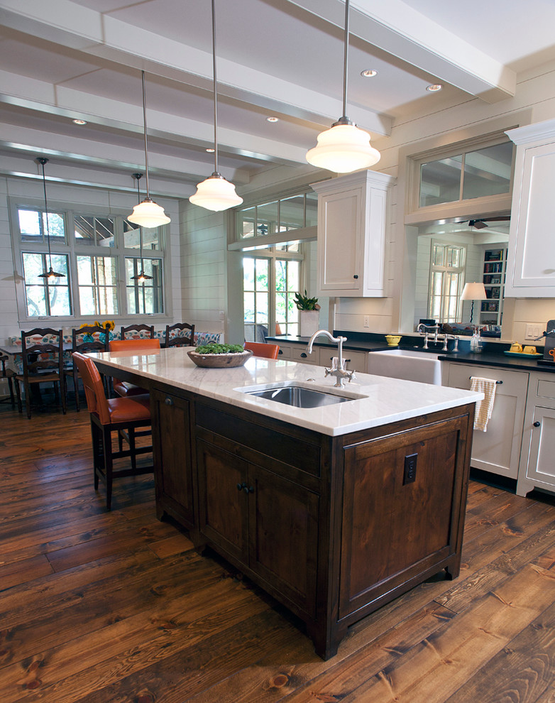 Design ideas for a traditional eat-in kitchen in Austin with a farmhouse sink, shaker cabinets and white cabinets.