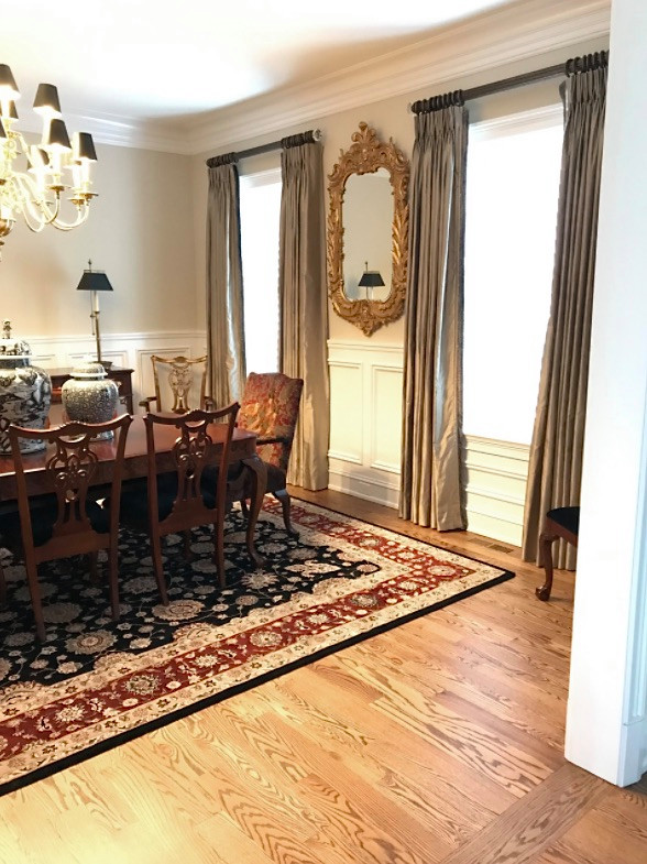 Mid-sized traditional separate dining room in Philadelphia with beige walls, light hardwood floors, no fireplace, beige floor and decorative wall panelling.