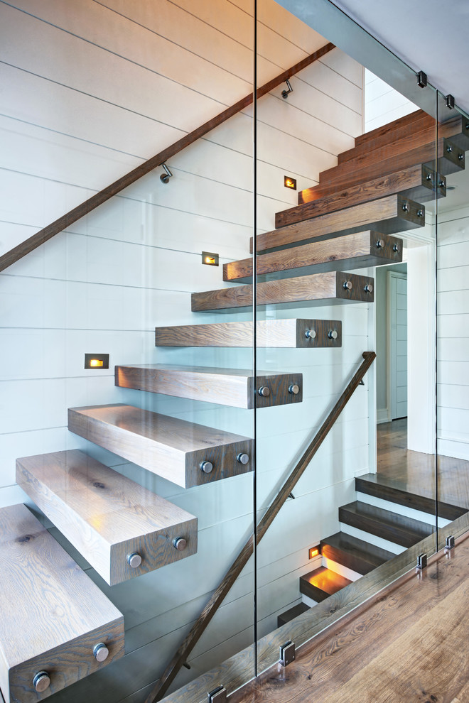 Inspiration for a contemporary wood straight staircase in Other with open risers.