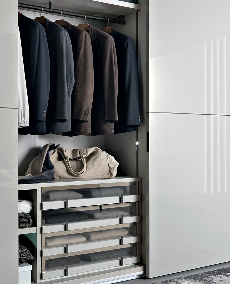 Small contemporary gender-neutral storage and wardrobe in Dorset with beige cabinets.