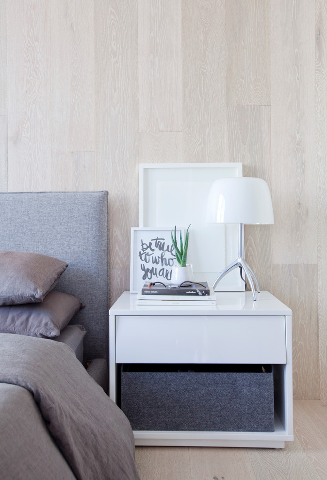 Design ideas for a small scandinavian master bedroom in Vancouver with white walls and light hardwood floors.