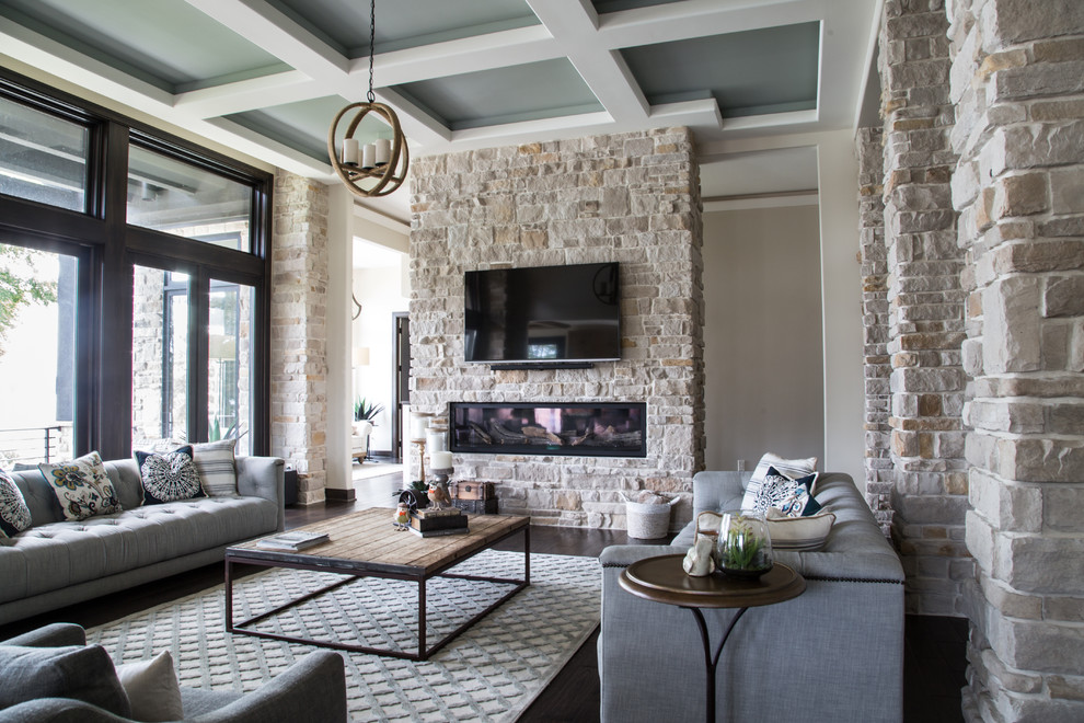 Design ideas for a transitional living room in Cleveland with white walls, dark hardwood floors, a ribbon fireplace, a stone fireplace surround, a wall-mounted tv and brown floor.