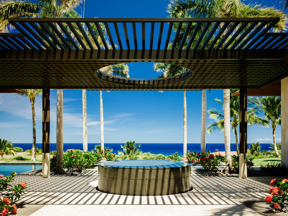 Inspiration for a tropical patio in Hawaii with a pergola.