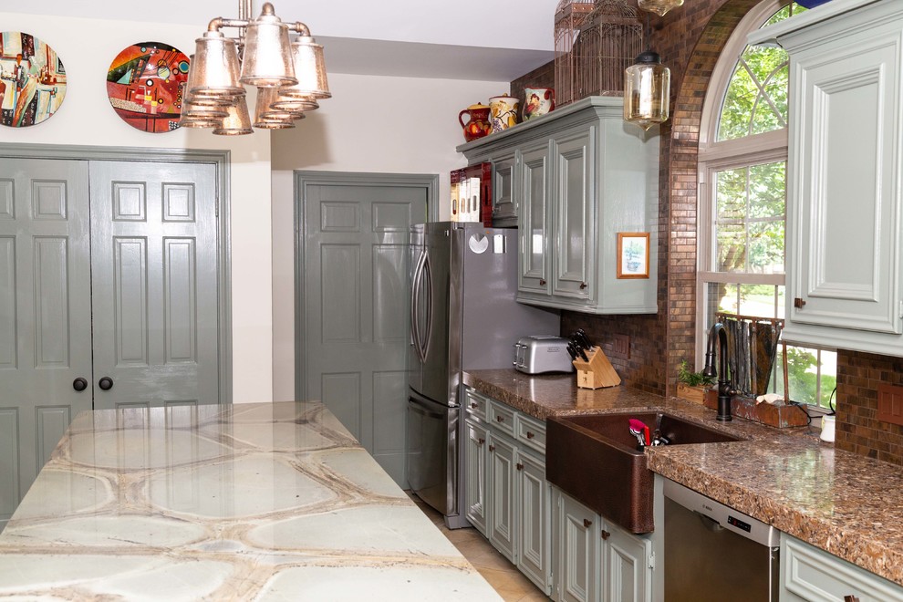 Photo of a large traditional u-shaped kitchen pantry in Houston with a farmhouse sink, beaded inset cabinets, green cabinets, quartzite benchtops, brown splashback, metal splashback, stainless steel appliances, porcelain floors, with island, beige floor and green benchtop.