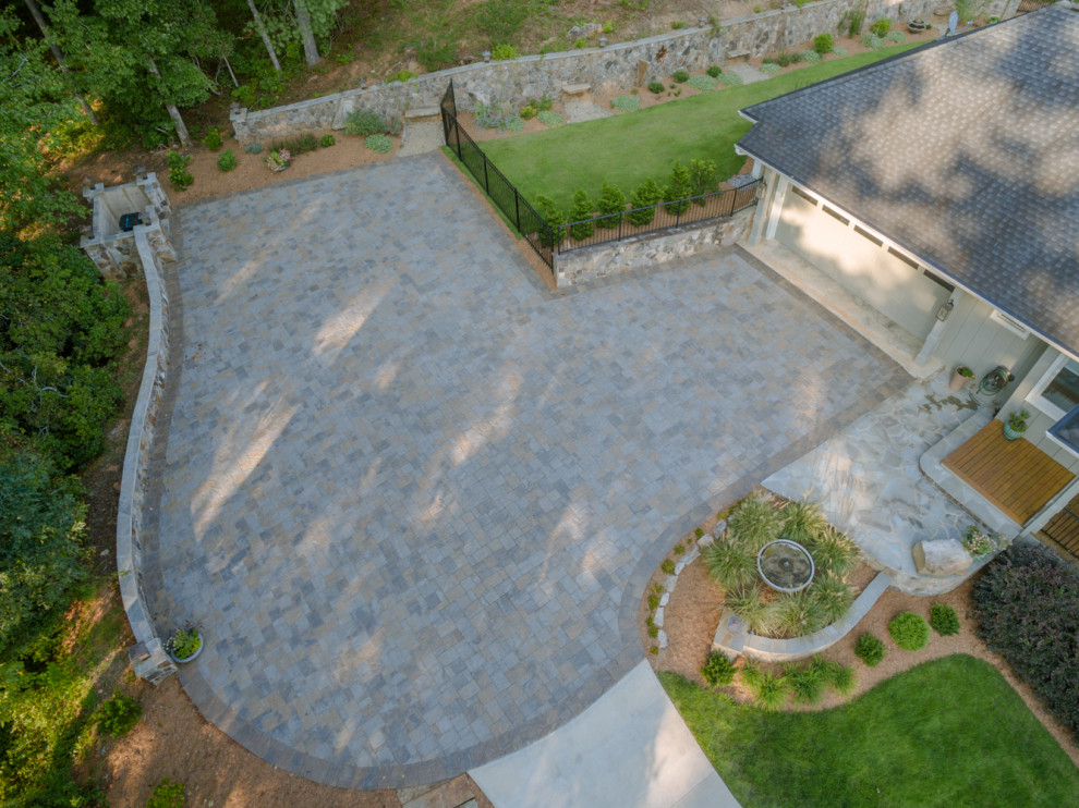 Design ideas for a large eclectic front yard driveway in Atlanta with concrete pavers.