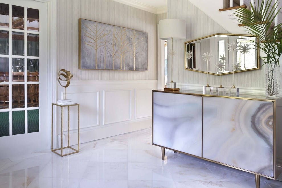 Mid-sized transitional hallway in New York with white walls, white floor and marble floors.