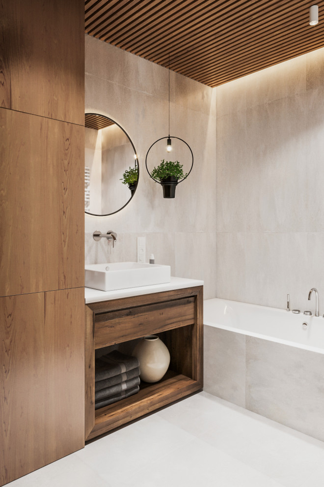 Mid-sized contemporary master bathroom in Other with flat-panel cabinets, medium wood cabinets, beige tile, porcelain tile, white walls, porcelain floors, solid surface benchtops, white floor, white benchtops, an alcove tub, a vessel sink and wood walls.
