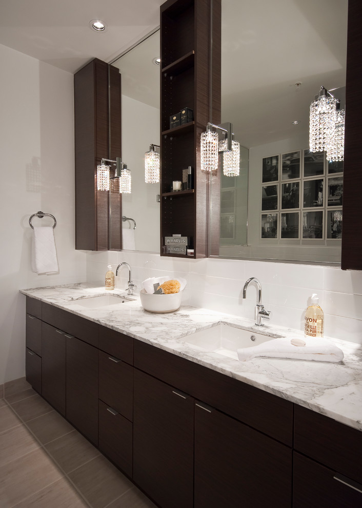 Inspiration for a contemporary bathroom in Vancouver with an undermount sink, flat-panel cabinets and dark wood cabinets.